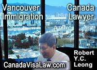 Robert Y.C.. Leong, in office with view of Vancouver BC  Falsecreek 